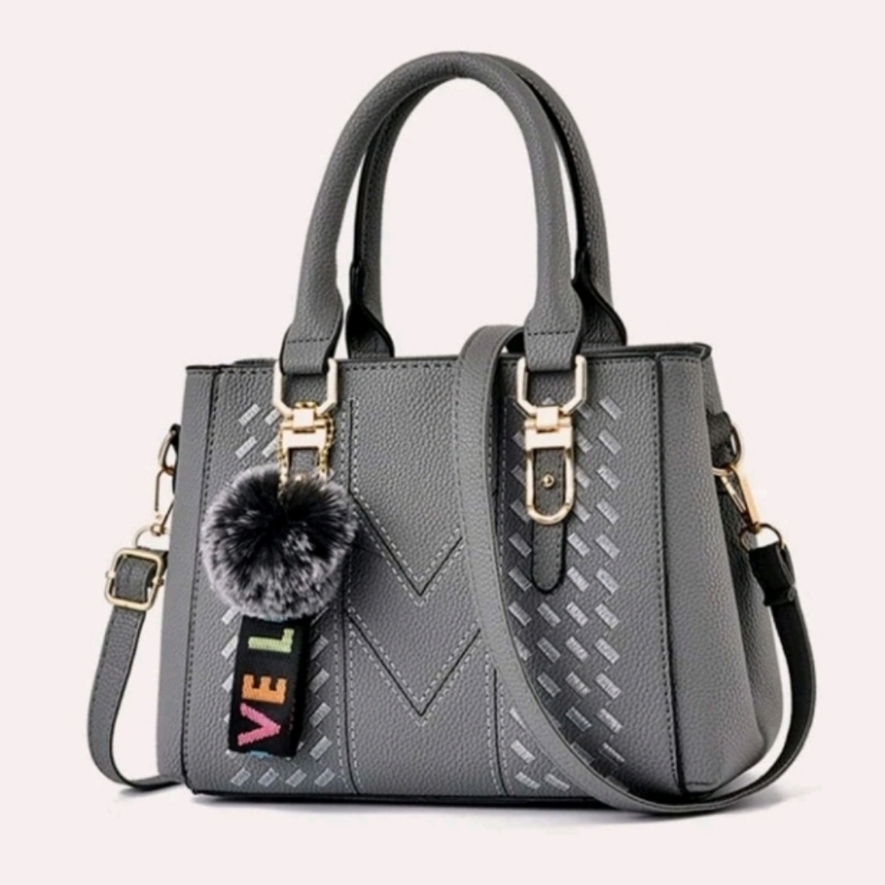 Pom-pom double handle hand bag